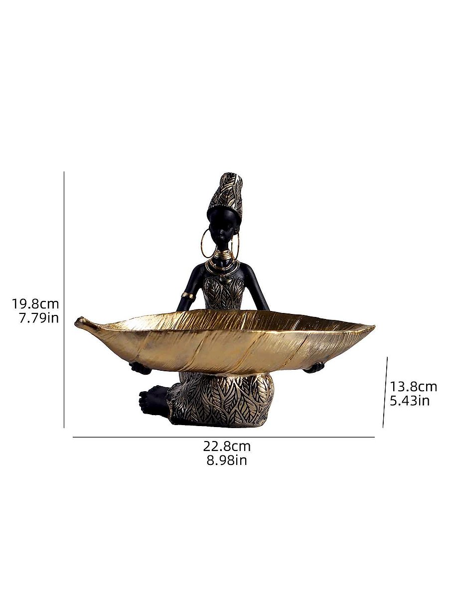 African girl sculpture displayed on a sideboard with earthy home decor