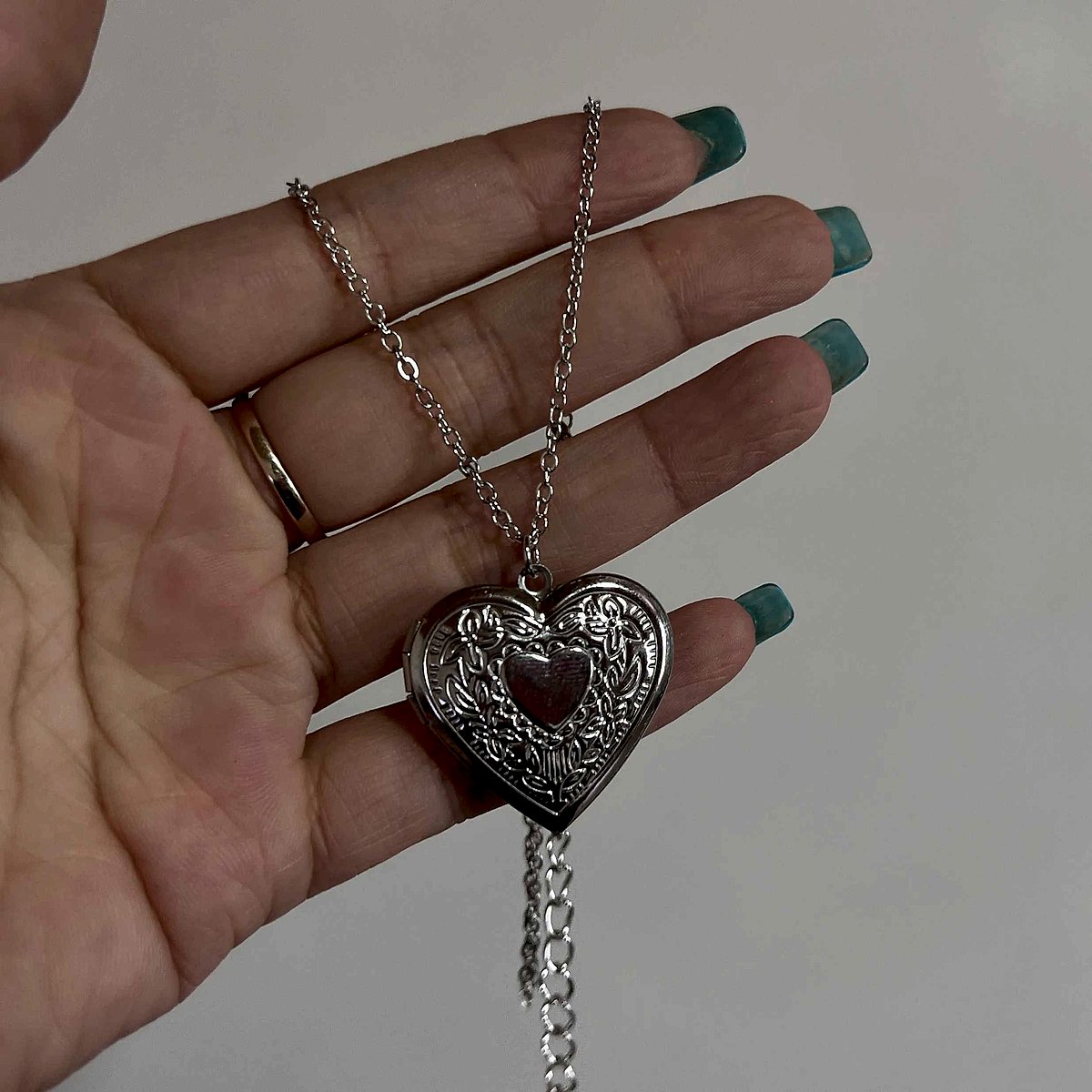 Silver stainless steel heart locket necklace worn
