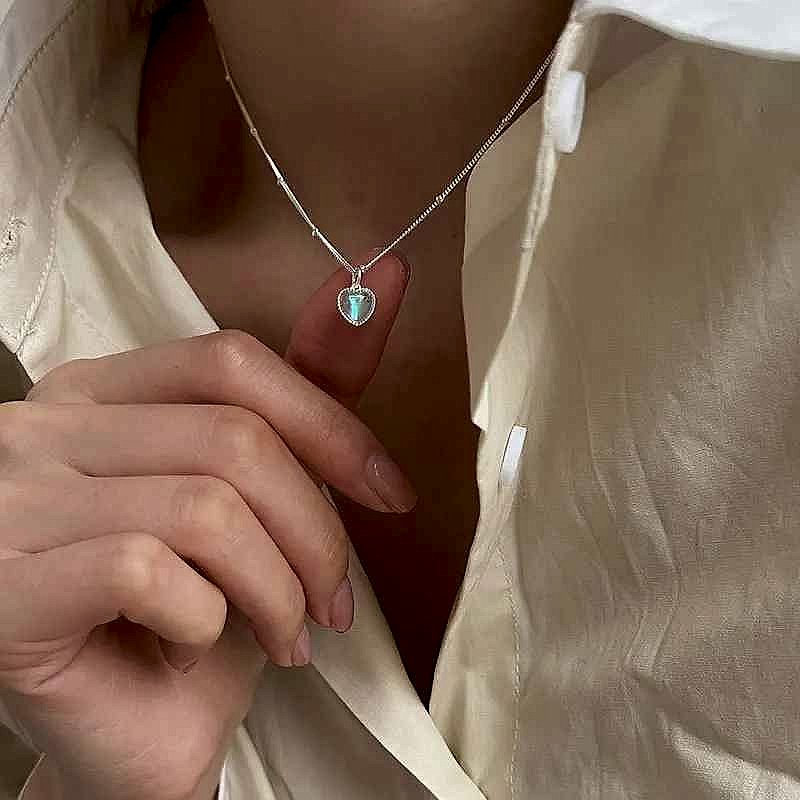 Handcrafted vintage-style moonstone gradient love pendant clavicle necklace with crystal layered elegance close-up | BigMoets