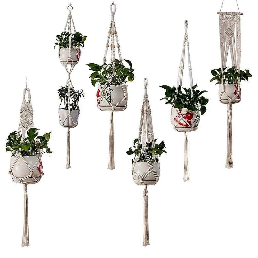 Bohemian macrame plant hanger with mesh-lined basket hanging on a wall
