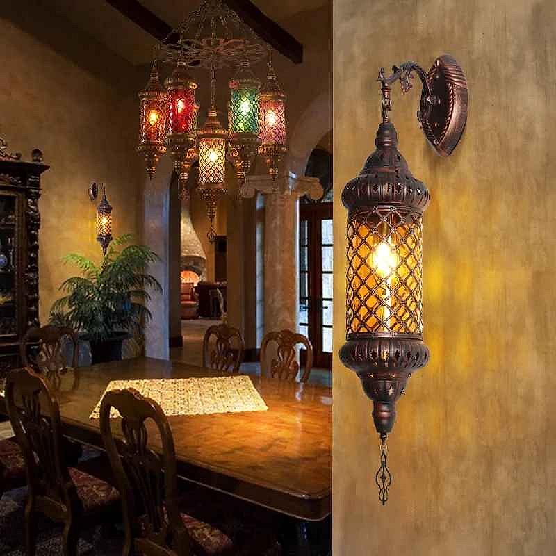 Moroccan arabesque wall lamp illuminated, casting geometric light patterns on a wall