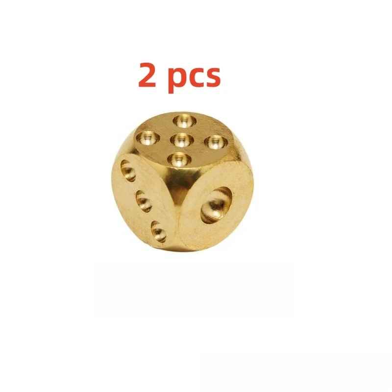 Solid brass dice pair showing warm stonewash patina and hand-polished finish