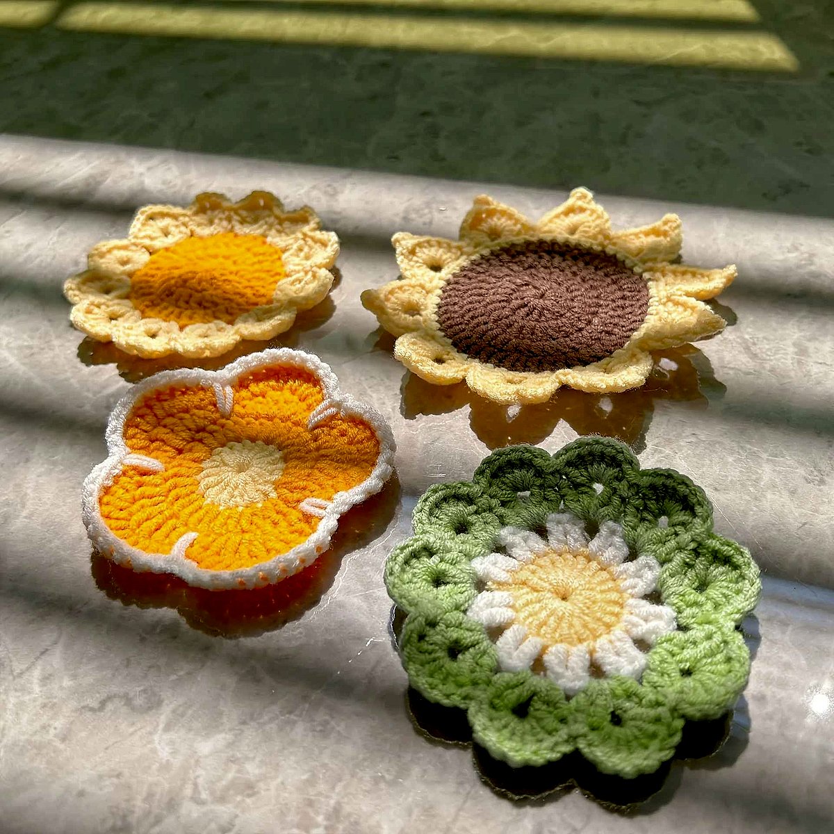 Handmade crochet sunflower coaster in yellow and brown tones, textured floral detail, perfect for mugs | BigMoetsy