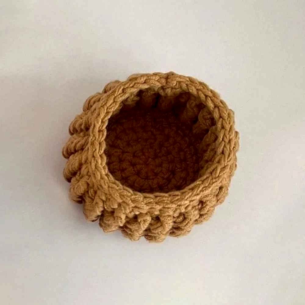 Handmade crochet sunflower coaster in yellow and brown tones, textured floral detail, perfect mug grip | BigMoetsy
