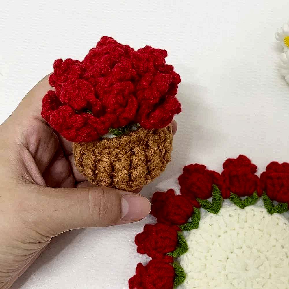 Handmade crochet sunflower coaster in yellow and brown, protecting table surface from mug rings | BigMoetsy